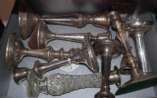 Nine assorted silver or white metal single candlesticks,